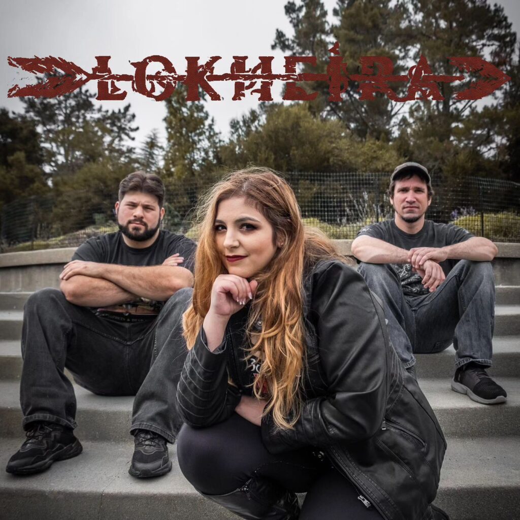 Picture of Lokheira band members sitting outside with band logo above